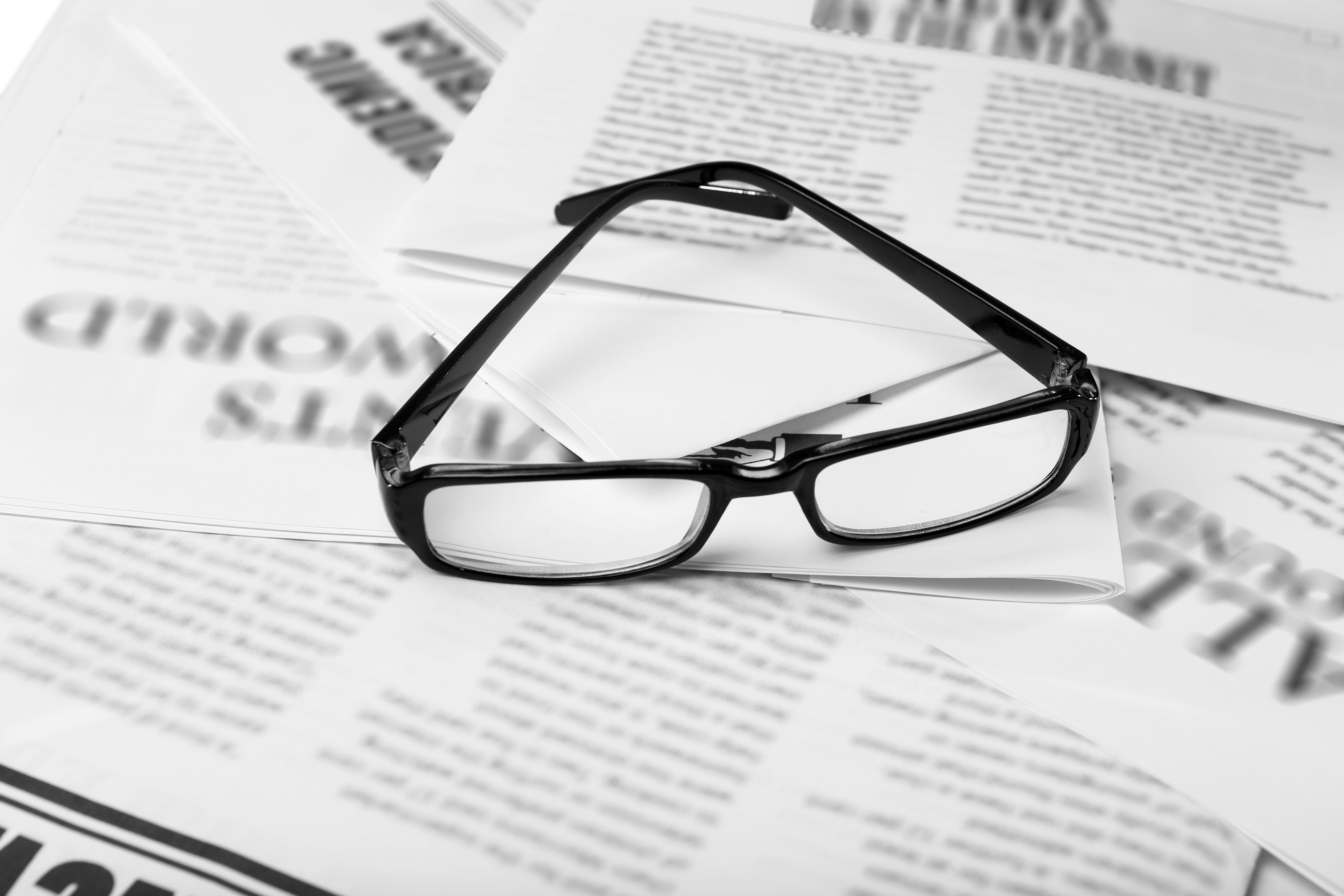 Glasses and Newspapers, Close-up